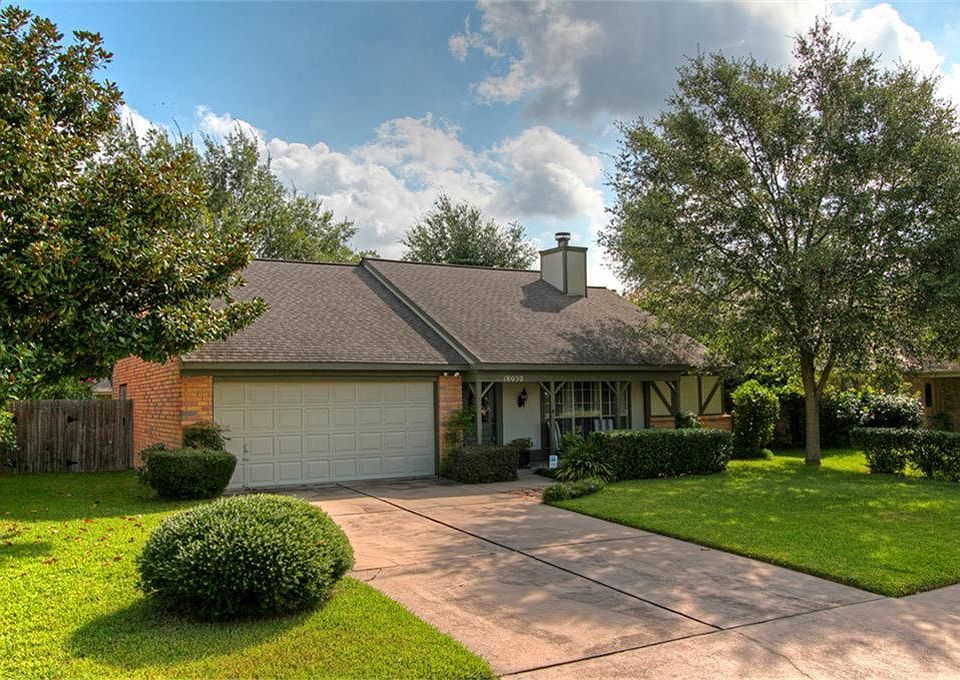 ***Charming Home*** Beautiful home nestled among mature shade trees. Covered front porch has room fo