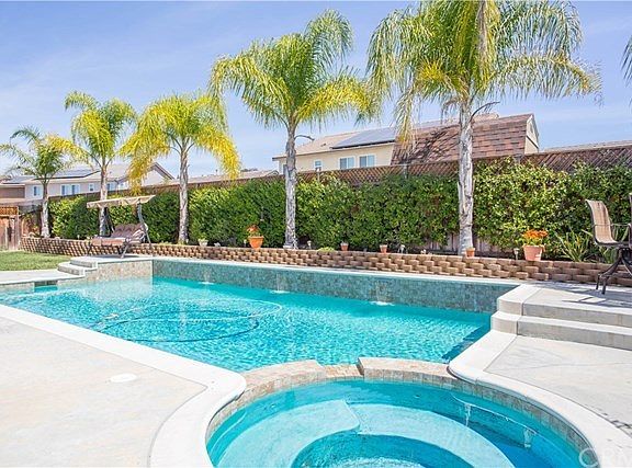 Well landscaped backyard with saltwater pool and spa. 3 water features.