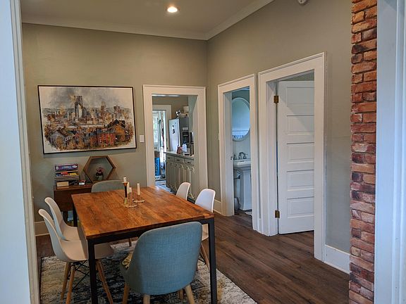 Large dining room with access to second bedroom and bathroom.