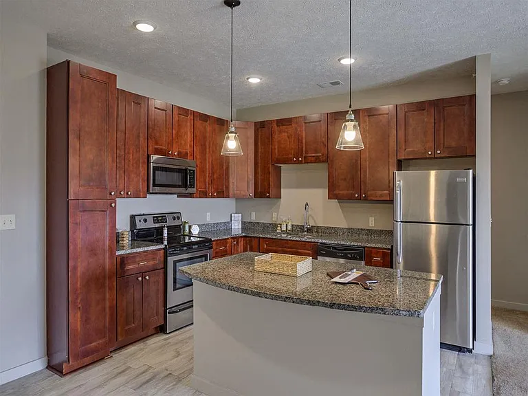 Modern kitchen with stainless steel appliances at Avenue 204.