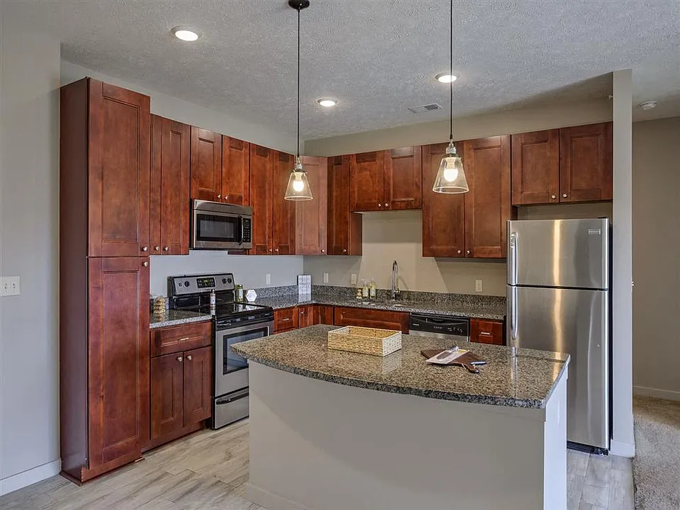 Modern kitchen with stainless steel appliances at Avenue 204.
