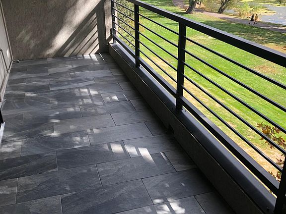 21' x 7' tiled balcony, with view of lake and mountains