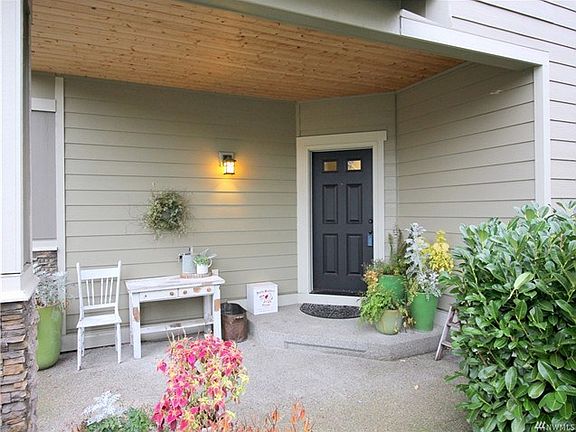 The covered front porch is a great spot to sit, decorate and get out of the weather.