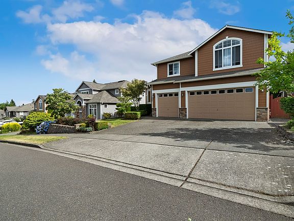 Front of house ft 3-car garage
