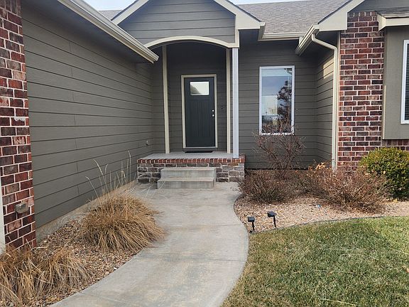 Nice landscape with welcoming front porch