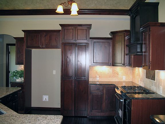 Hidden, Walk-in Pantry (tall narrow doors at center of photo)