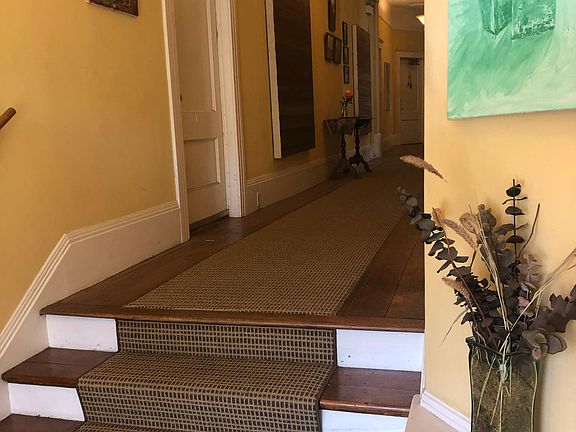 Entry just inside front door.