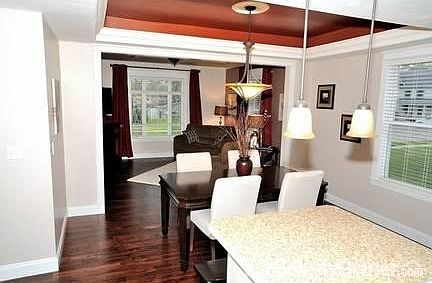 Spacious open floor plan
						:
						The kitchen flowing into the dining room, flowing into the family room