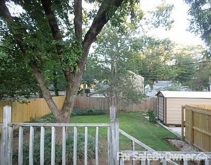 Back yard
						:
						Features deck, privacy fence and new 8x12 Morgan building for storage