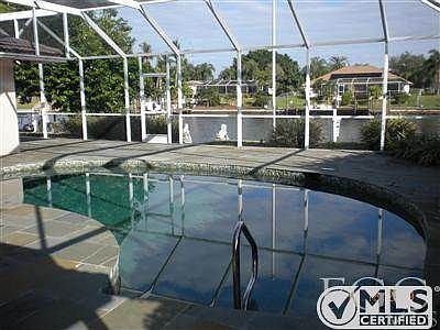 Fabulous view of pool and 180'wide canal! Huge lanai with p