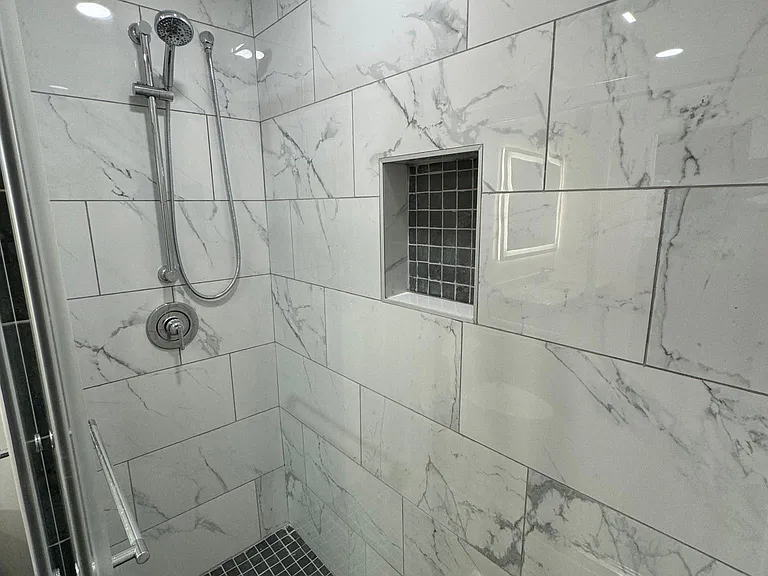 Primary upstairs bathroom shower.