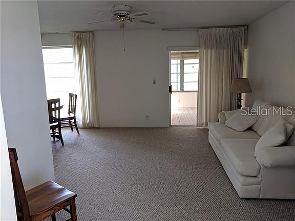Living & dining area from the Front entry, Sliding doors open to the enclosed porch.