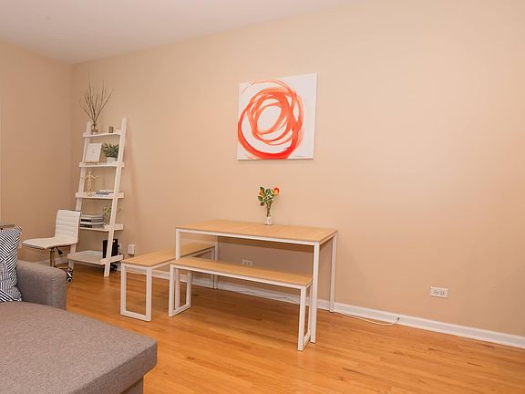 Living area overlooking study or dining nook