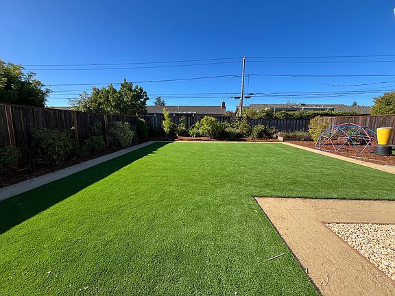 Backyard artificial lawn looking South.