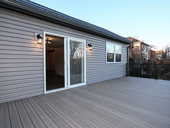 Large Composite 12' x 24' deck with aluminum railing.