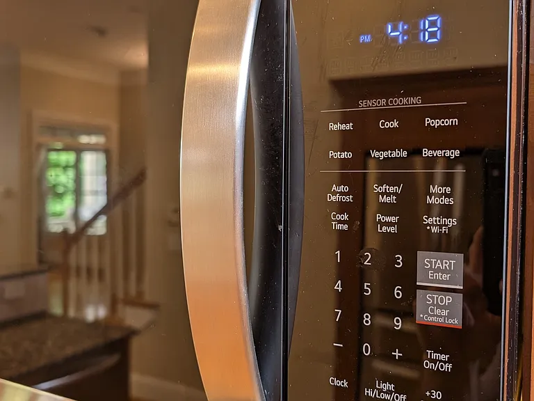 Advanced microwave with extendable vent option over the cooktop.