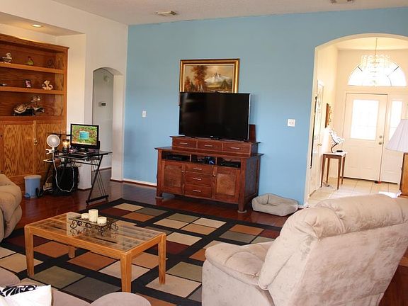 The spacious den is open to the kitchen and has lots of natural light.