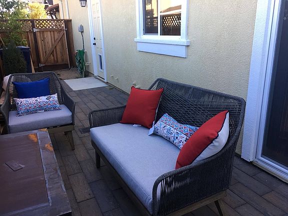 Outdoor area with built-in fireplace (hooked up to natural gas - no propane needed!) Patio furniture is not included.