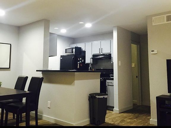 View of Dining/Kitchen from Couch.