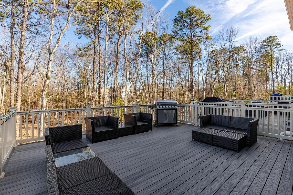 Largest deck in the community, backing to woods! - 8274 Hickory Hollow Dr