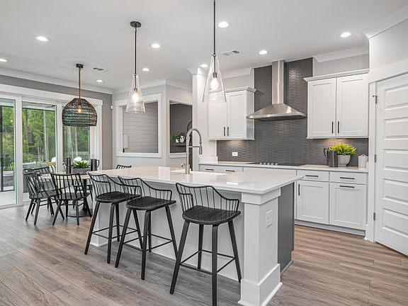 Kitchen with large corner pantry.