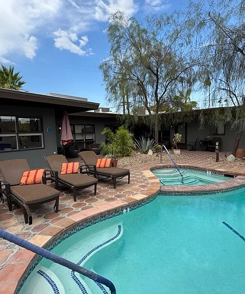 Courtyard view across pool to north east. Spa seen beyond pool at center of photo.
