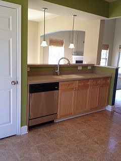 Kitchen overlooks the dining and great room