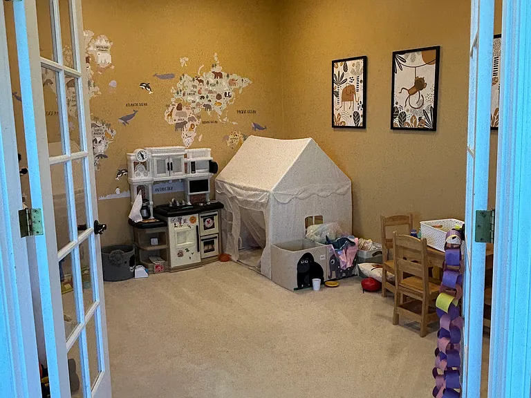 Playroom, office, or media room off of the kitchen and living room