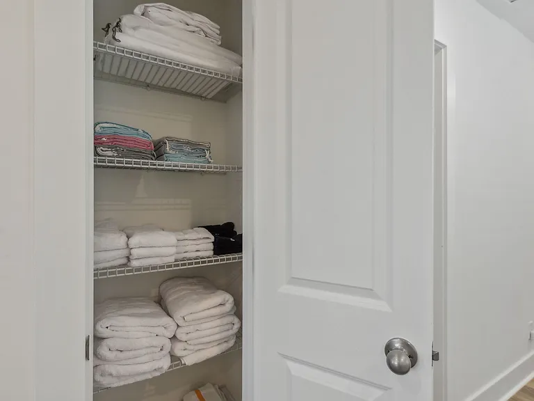 Linen closet with towels, hand towels, wash cloths, makeup cloths, beach towels, cleaning towels and additional sheets for each bed