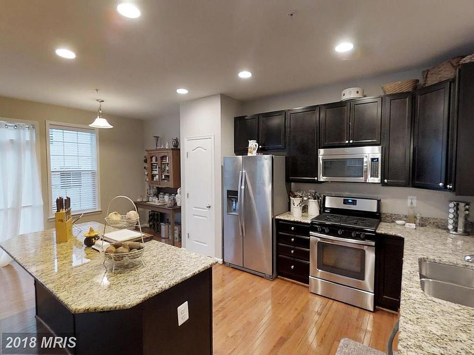 Cook s kitchen with espresso cabinets, granite countertops, 