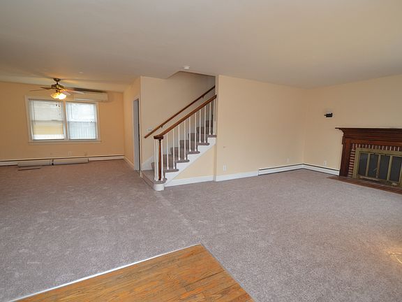Living room with brand new carpet.