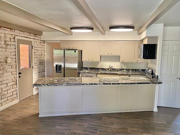 Kitchen with new stainless steel appliances and granite countertops