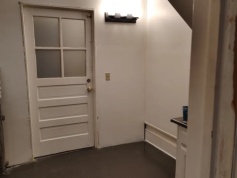 And back around to Front entry room (looking North from Middle bedroom).