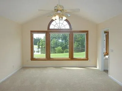 Spacious primary bedroom and bathroom. A great view to start the day!