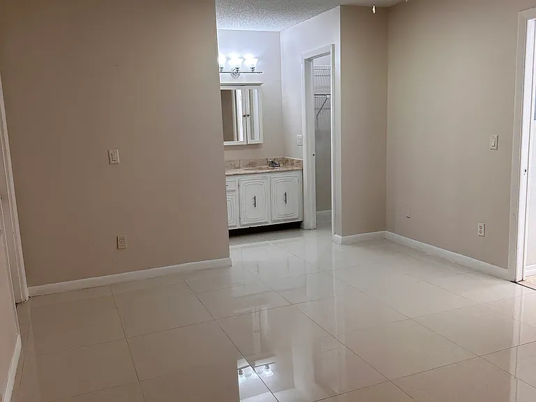Master bedroom, looking toward the vanity and one of the walk-in closets.