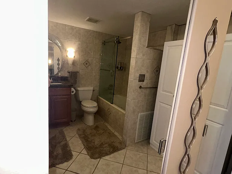 View of primary closets and bathroom