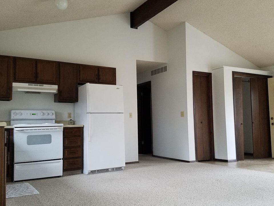 Kitchen with vaulted ceiling and laundry area off to the rig