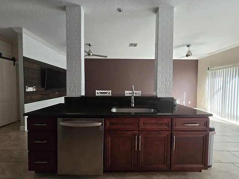 Kitchen looking into living room