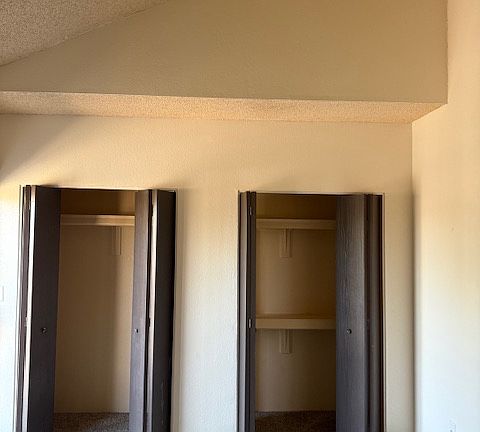 Lots of closet space in bedrooms with soaring, vaulted ceilings
