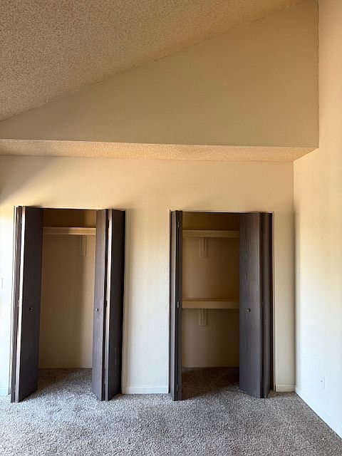 Lots of closet space in bedrooms with soaring, vaulted ceilings