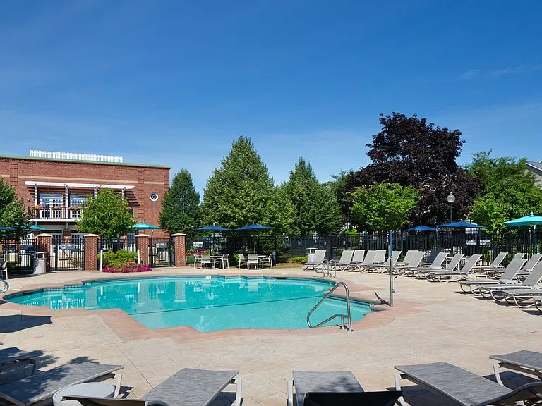 Swimming pool and sundeck with lounge seating