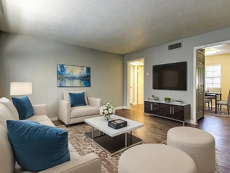 Experience comfort in this elegantly designed living room that blends style with relaxation.