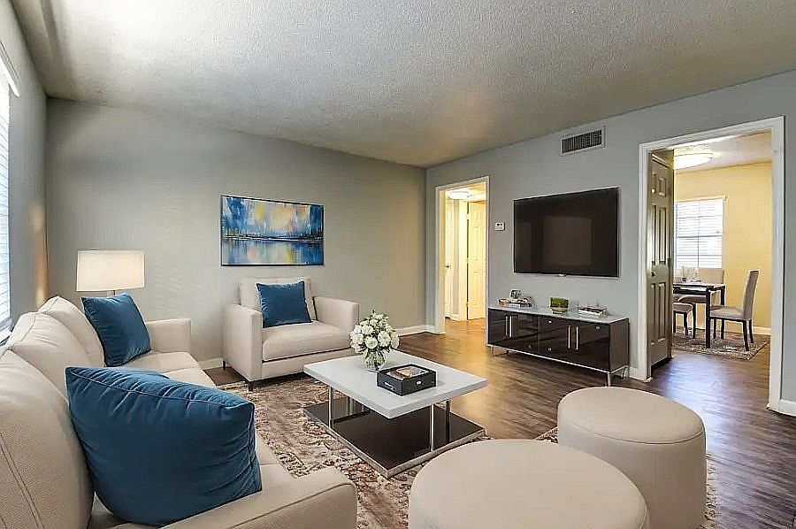 Experience comfort in this elegantly designed living room that blends style with relaxation.