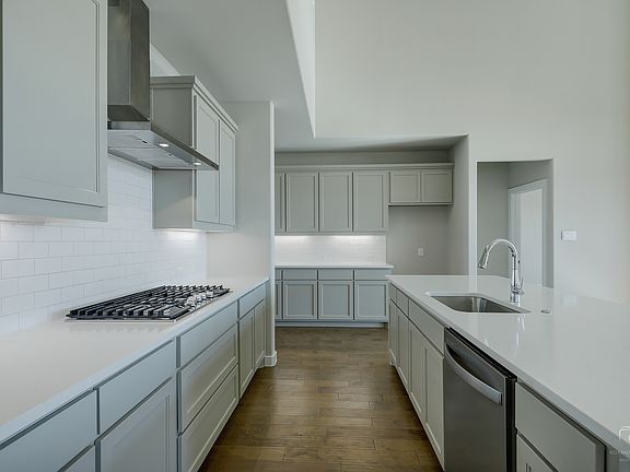 Kitchen in the Mercury home plan by Trophy Signature Homes - REPRESENTATIVE PHOTO