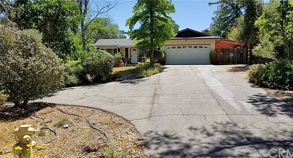 Front of house from the street notice the extra parking area