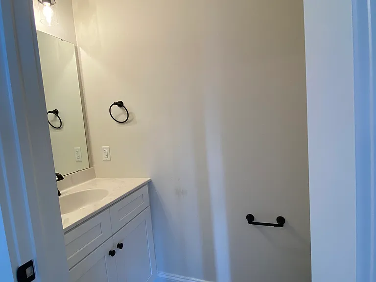 Half bath off of dining/kitchen/living area