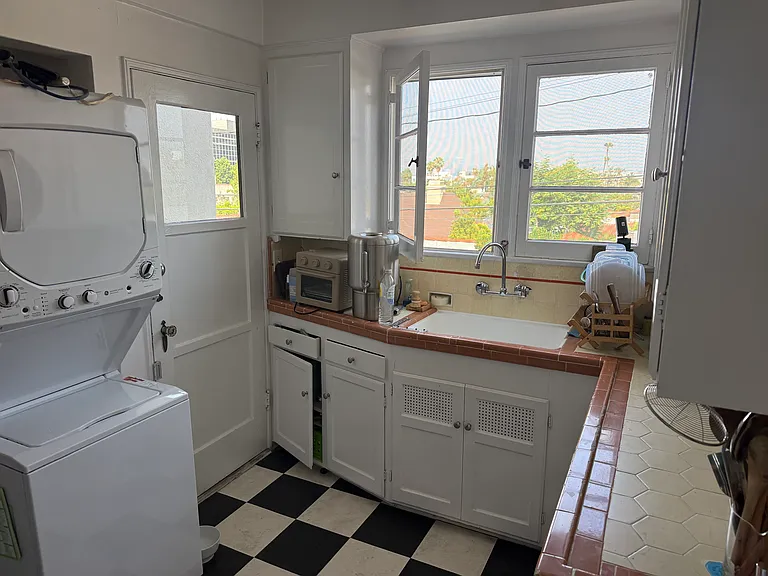 Washer and dryer + back door that leads to parking