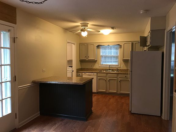 kitchen w/ island; fr "den".