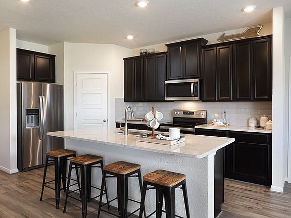 Cook delicious meals in the gourmet kitchen.