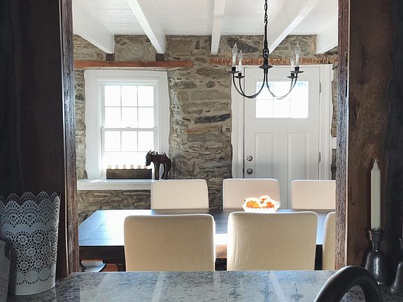 Pass through stone kitchen with stainless appliances